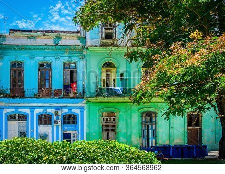 Havana, Cuba, July 2019, View Of Two Colorful Buildings In Calle San Juan De Dios In The Old Part Of