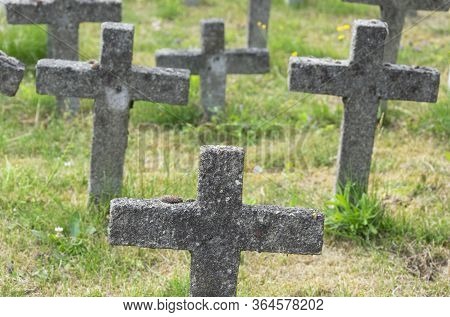 Sint Gillis Waas, Belgium, 8 July 2019, Concrete Crosses In An Old Graveyard