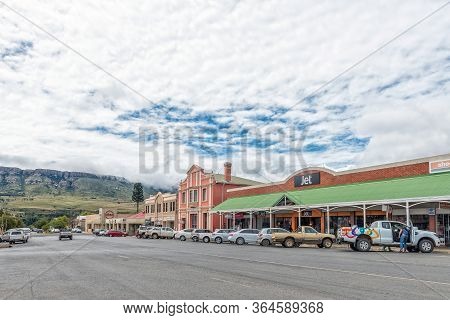 Harrismith, South Africa - March 16, 2020:  A Street Scene, With Businesses And Vehicles, In Harrism