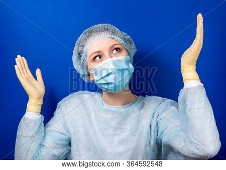 A Young Doctor In A Medical Uniform Makes A Forbidden Gesture With His Hands. Medical Design Concept