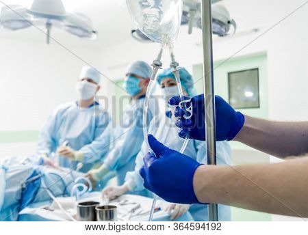 Arthroscope Surgery. Orthopedic Surgeons In Teamwork In The Operating Room