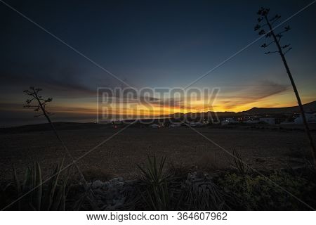 Stunning sunset at Lanzarote Island. From the top of a mountain. A beautiful view at Tias.