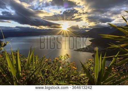 Sunrise At Lake Atitlan In Guatemala With Trees