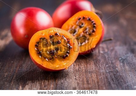 Fresh tamarillo fruit on wooden background