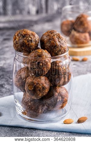 Energy Balls Of Dried Fruits And Nuts In A Glass Jar, Sellective Focus On Background.the Concept Of 