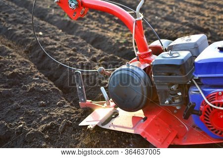 Farmer In A Field With Rototiller , Tiller Tractor
