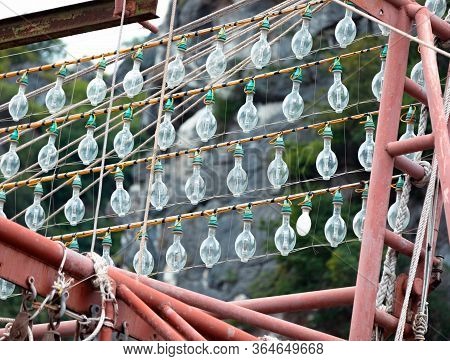 Light Bulbs In Rows On The Fishing Boat Ready For Squid Fishing On Lan Hay Bay In Vietnam