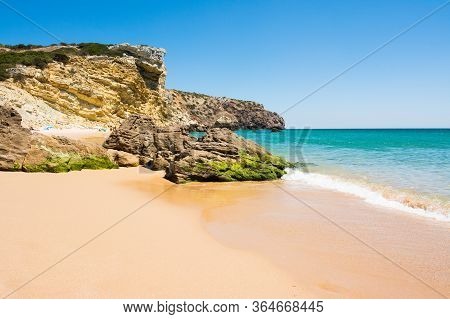 Rocks On Sandy Praia Do Amado Beach, Portugal
