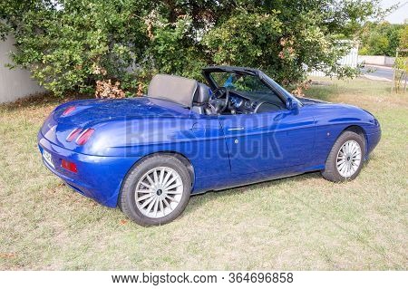 Bordeaux , Aquitaine / France - 04 26 2020 : Fiat Barchetta Convertible Blue Car On Green Grass Ital