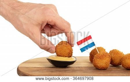 Dutch Traditional Snack Bitterbal In A Hand, Isolated