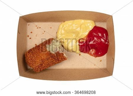 Partly Eaten Brown Crusty Dutch Kroket With Mustard And Ketchup Isolated On A White Background