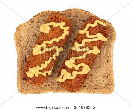 Brown Crusty Dutch Kroket With Mustard Topping Isolated, On A Piece Of Bread, On A White Background