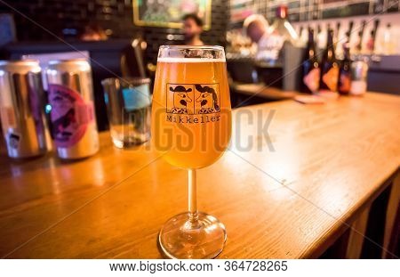 Copenhagen, Denmark: Craft Beer Bar With Glass Of Popular Danish Beer By Mikkeller Brewery, In Speci