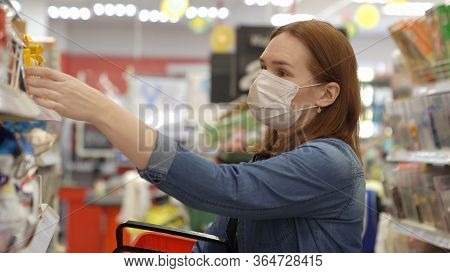 Woman Buyer Wearing A Protective Mask.shopping During The Pandemic.emergency To Buy List.panic Buyin