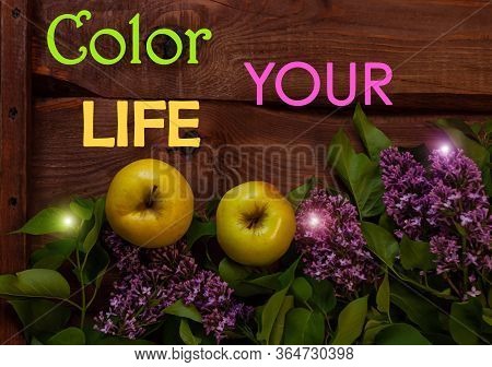 Bright Yellow Apples, Purple Lilac Flowers With Fresh Green Leaves On Wooden Background Flat Lay.col