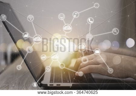 Hand Typing On Laptop And Virtual Artificial Intelligence With Cloud Technology Transformation And I