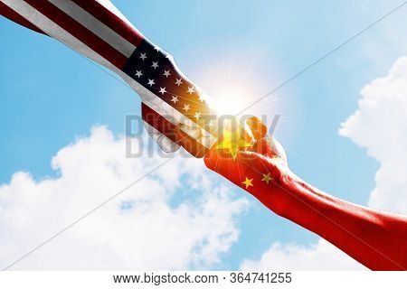 Usa And China Flag Print Screen On Fist And Boxing Fighting With Cloud Sky. United States Of America