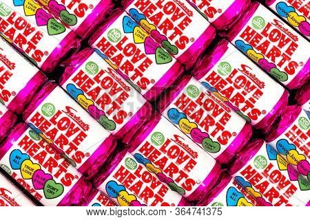 Southampton, UK - 3rd May 2020:  background of Swizzels Love Hearts. This popular childhood fizzy sweet is a hard candies embossed with love messages and has been in production for nearly 70 years