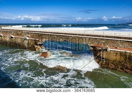 Broken Jetty By Cantabrico Waves At Tempest