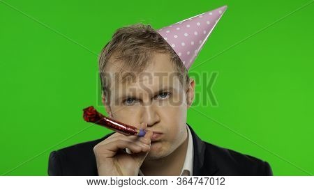 Portrait Of Drunk Unhappy Young Clerk Man With Hangover Blowing A Whistle. Emotions. Disheveled Guy 