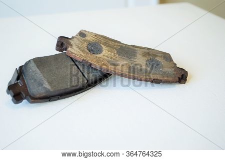 Worn Out Ruined Disc Brake Pad Compared To One That Is New