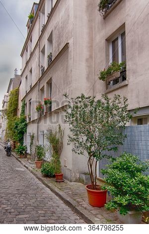 Charming Flower Quarter With Apartment Building In Paris, Rue Des Thermopyles, 14 Arrondisement. Fra