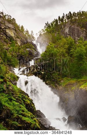 Norwegian Landscape. Waterfall Latefoss Latefossen, Odda Hordaland County In Norway. National Touris