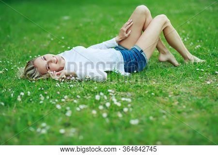 Beautiful Woman With A Flower. Girl With Camomiles. Beautiful Woman Portrait.