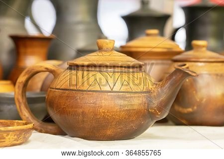 Pottery. Clay Teapot.background Beautiful Ceramic Products.background Beautiful Ceramic Products Wit