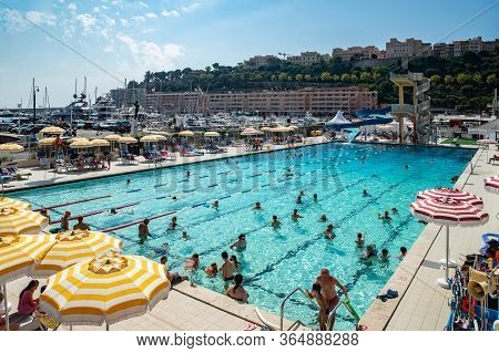 Monaco, Monte-carlo, 06 August 2018: The Famous Pool In Port Hercules, Is The Parked Boats, Sunny Da