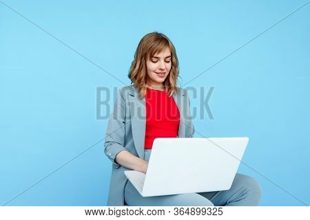 Attractive Caucasian Woman Is Working On Her Lapop.