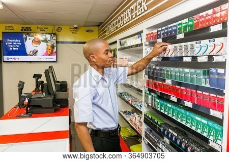 Johannesburg, South Africa - November 22, 2016: Grocery Store Staff Packing Shelves At Local Pick 'n