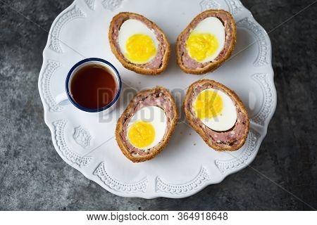 Close Up Of Rustic Traditional English Comfort Pub Food Scotch Egg