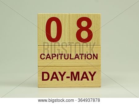 May 8 On The Calendar. Victory Day. Calendar On A White Background. Word Capitulation On Wooden Cube