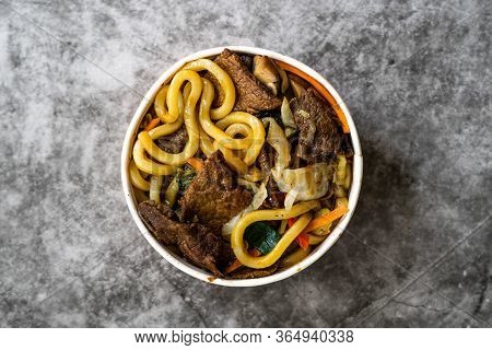 Take Away Asian Style Japanese Udon Noodle Soup With Beef, Mushroom And Vegetables In Plastic Bowl P
