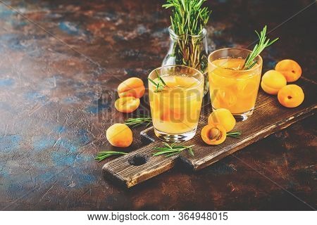 Summer Drinks, Rosemary Aprcot Cocktails With Ice In Glasses. Refreshing Summer Homemade Alcoholic O