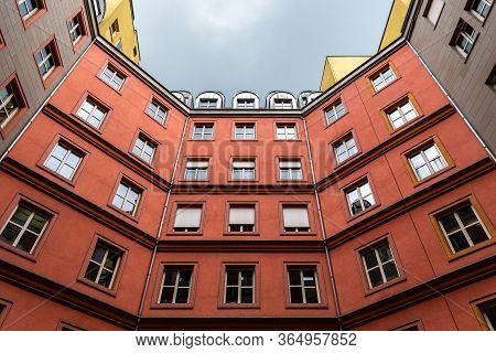 Berlin, Germany - July 29, 2019: Courtyard Of The Colorful Residential Buildings In Quartier Schutze