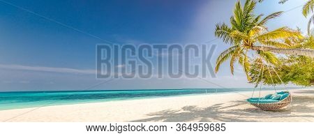 Tropical Beach Panorama As Summer Landscape With Beach Swing Or Hammock And White Sand And Calm Sea 