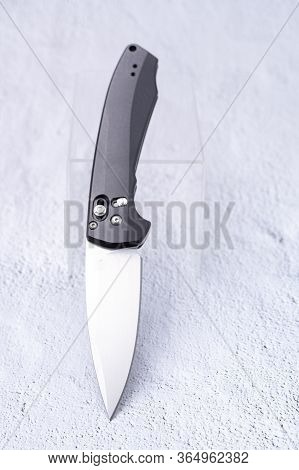 The Knife In An Upright Position Is Inclined At An Angle.
