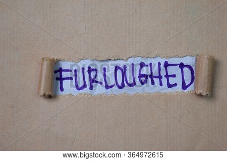 Furloughed Text Written In Torn Paper. Medical Concept