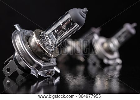 Car Bulb On The Table. Spare Accessories For Passenger Cars.