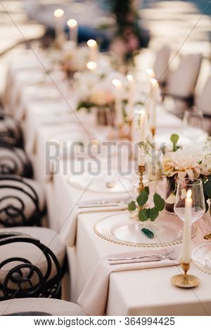 Wedding Dinner Table Reception. Close-up Of Wildcard With Gold Beads, Transparent Glass. Runner Of P