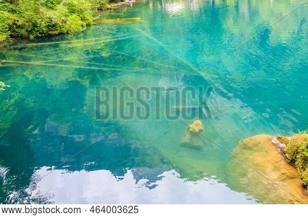 Underwater Statue Of Young Girl In Blausee Lake (blue Lake) In Bernese Oberland, Kandergrund, Switze