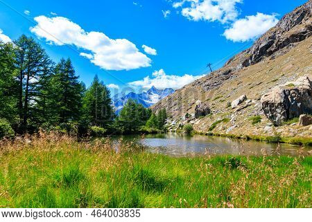 View Of Grindji Lake (grindjisee) And Swiss Alps At Summer On Five-lake Trail In Zermatt, Switzerlan