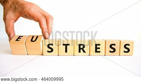 Eustress Or Stress Symbol. Psychologist Turns Cubes And Changes The Concept Word Eustress To Stress.