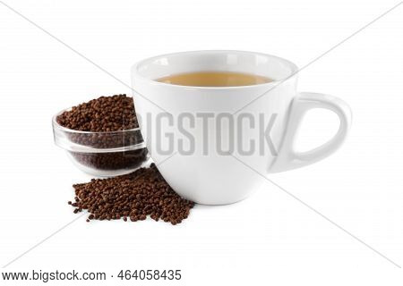 Cup Of Aromatic Buckwheat Tea And Granules On White Background