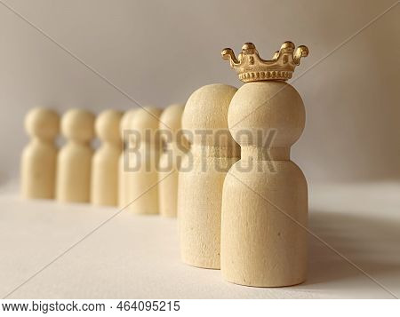 Image Of Wooden Toy With Crown Background. Leadership Concept. Stock Photo.