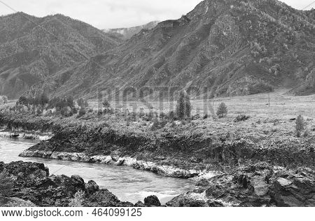 Orokto Valley Of The Katun River. The Rocky Shores Of The Mountain River Are Composed Of Volcanic Ro