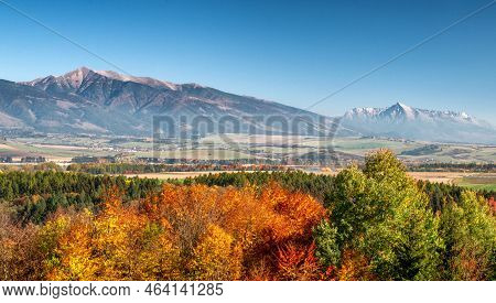 Autumn Landscape With Colorful Trees And High Peaks At Background. Western And High Tatras Mountains