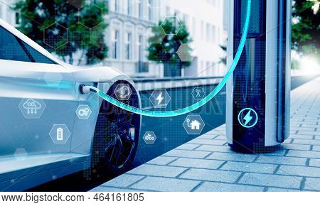 High-speed Charging Station For Electric Vehicles On City Streets With Blue Energy Battery Charging.